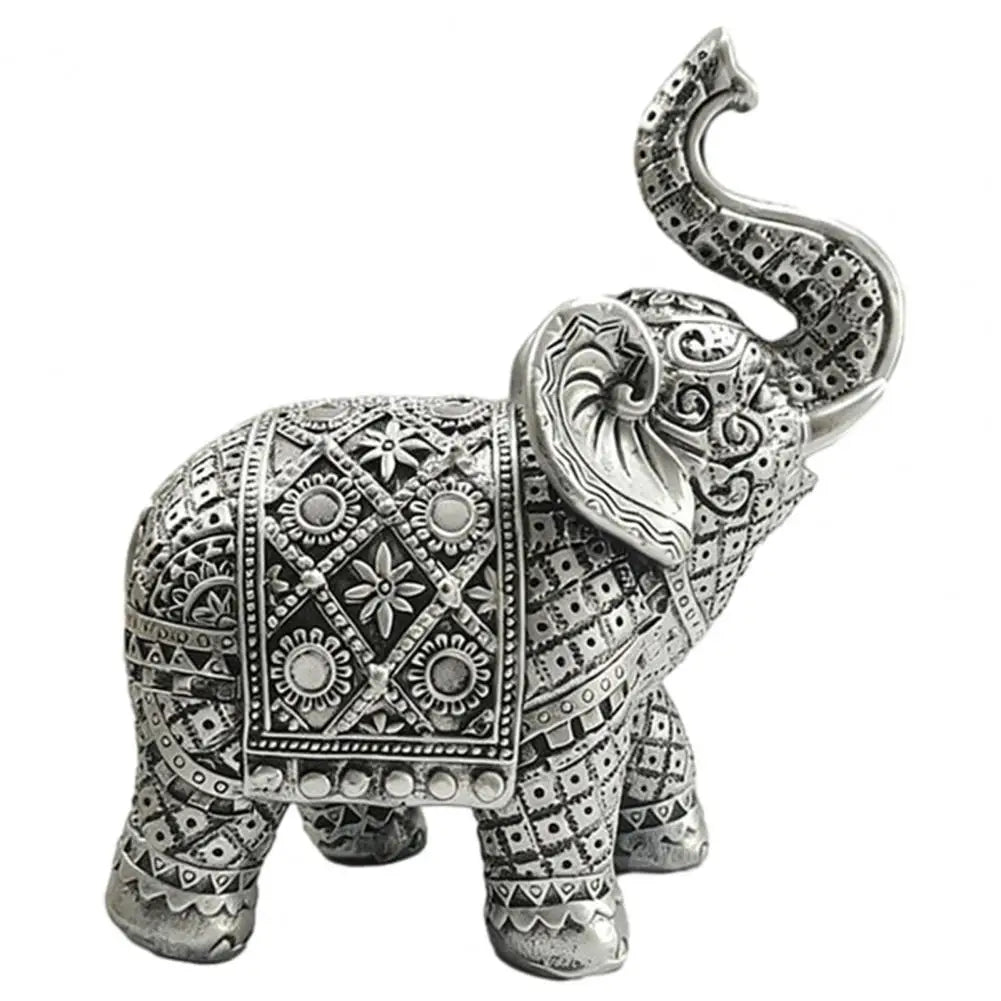 Silver resin elephant sculpture with intricate detailing and a curved trunk