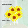 Five yellow sunflower cake toppers with brown centers on white sticks