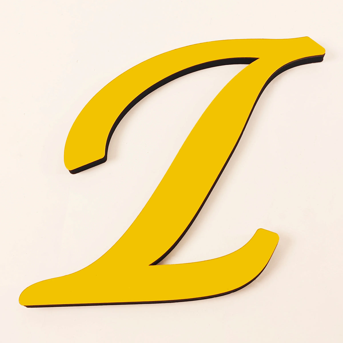 A bright yellow 3D acrylic letter Z wall sticker against a light background.
