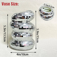 A stack of silver mirror tile disco ball vases showing various sizes and a measurement scale.