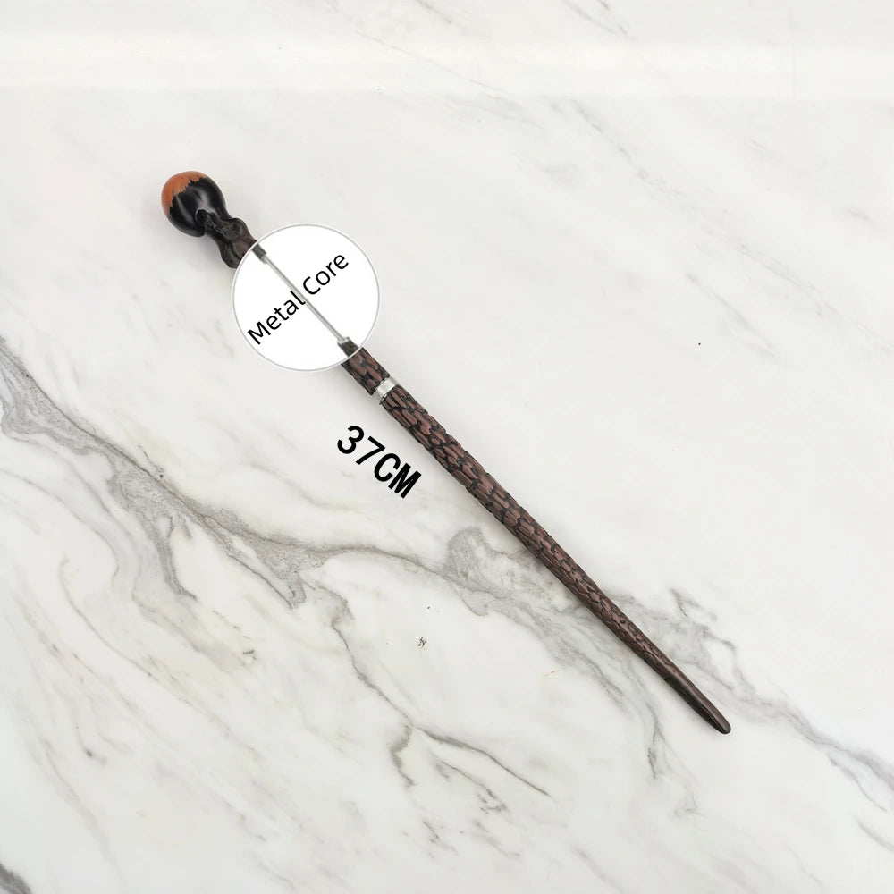 A dark wooden magic wand replica with a metal core is displayed on a white marble surface.