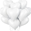 A bunch of white heart-shaped foil balloons tied together with string.
