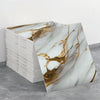 A stack of self-adhesive marble tile stickers featuring gold veining on a white background.