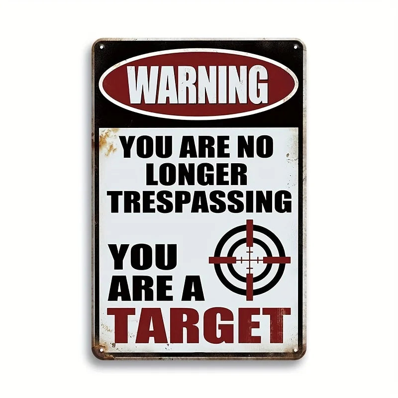A vintage metal tin sign with a warning that reads You are no longer trespassing You are a target