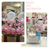 Pink balloons tied with pink satin ribbon bows for party gift decoration