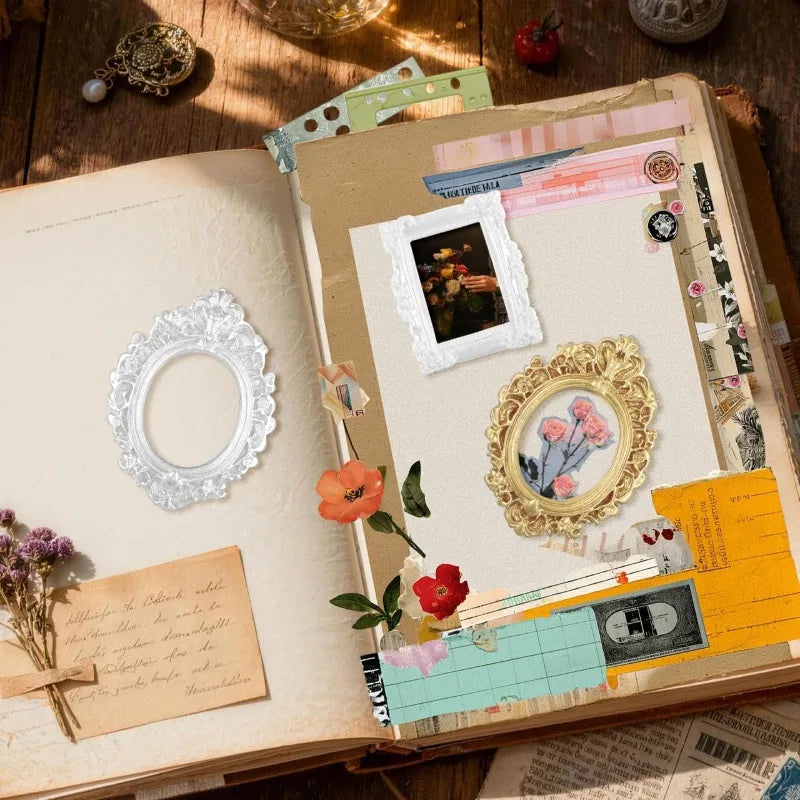 A page from a scrapbook showing vintage gold mini picture frames and various craft materials on aged paper.