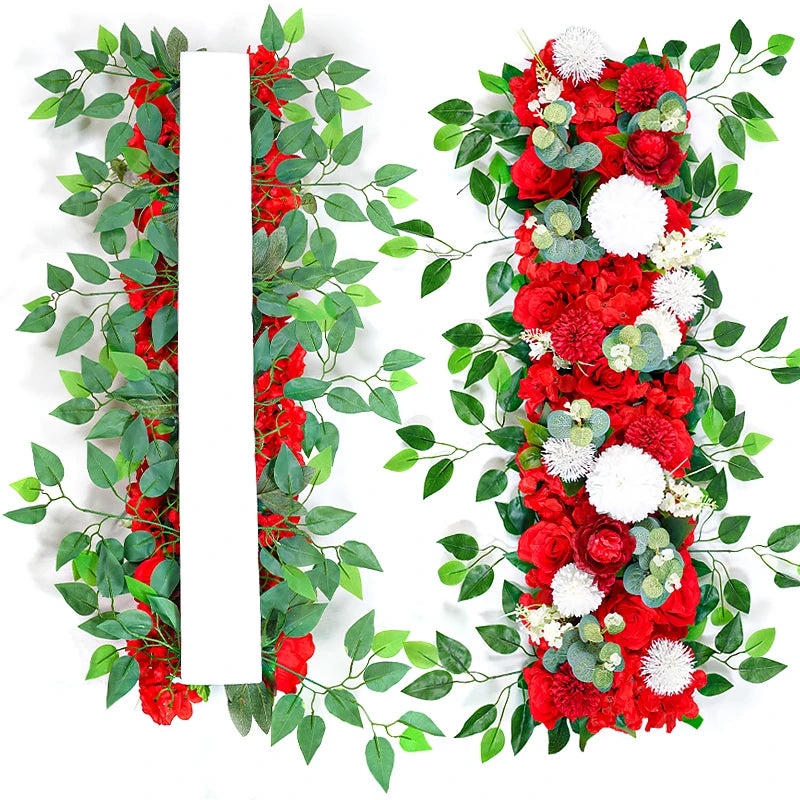 A vertical arrangement of red roses and green foliage with a white rectangular insert for event decor.