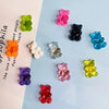 A collection of ten bear-shaped magnetic chalkboard and message stickers in various colors like green, pink, black, and blue.