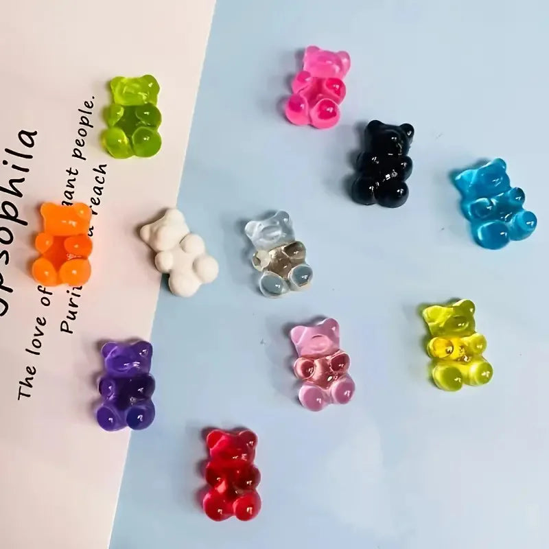 A collection of ten bear-shaped magnetic chalkboard and message stickers in various colors like green, pink, black, and blue.
