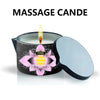 A massage candle in a tin with a lit wick and a silver lid.