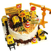 A cake decorated with construction vehicle toppers including an excavator, crane, and road signs.