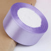Roll of purple satin ribbon for crafts and gift wrapping