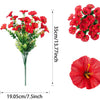 A bouquet of vibrant red artificial eucalyptus and morning glory flowers with a measurement scale.