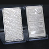 A silver bullion bar replica labeled Johnson Matthey Fine Silver 999 1 ounce Troy inside a clear plastic case.
