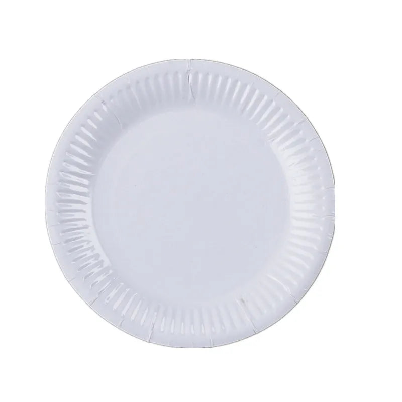 A white disposable plate with a ruffled edge.