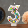 Glitter number 3 birthday candle decorated with colorful candy beads