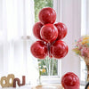 A display of red glossy balloons arranged on a stand for party decorations.