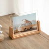 A walnut wood and acrylic photo frame displaying a vintage van on a scenic coastal road.