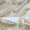 Roll of self-adhesive marble contact paper displaying natural veining on a marble surface.