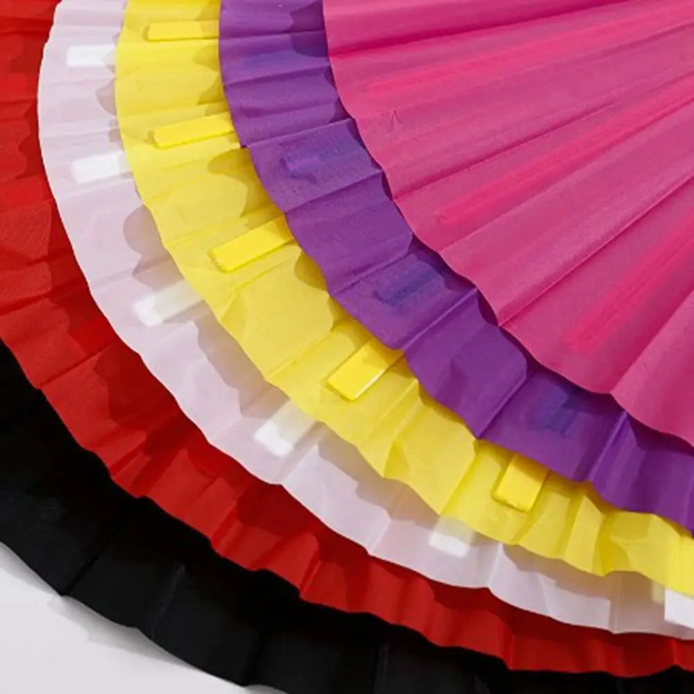 A fan made of colorful plastic ribs in shades of pink, purple, yellow, and red.