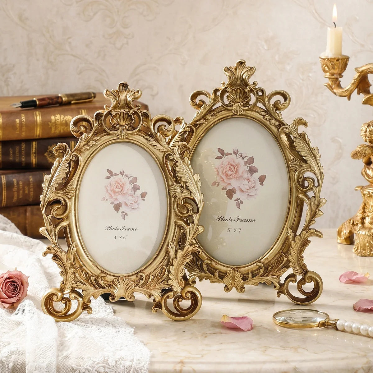 Vintage gold oval resin picture frame displayed on a marble surface with roses and a quill pen.