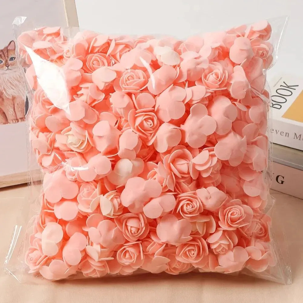 A clear plastic bag filled with pink PE foam artificial rose flowers for DIY decor