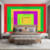 A luxury wall hanging featuring a golden tapestry with vibrant color blocks and a modern bed setting.
