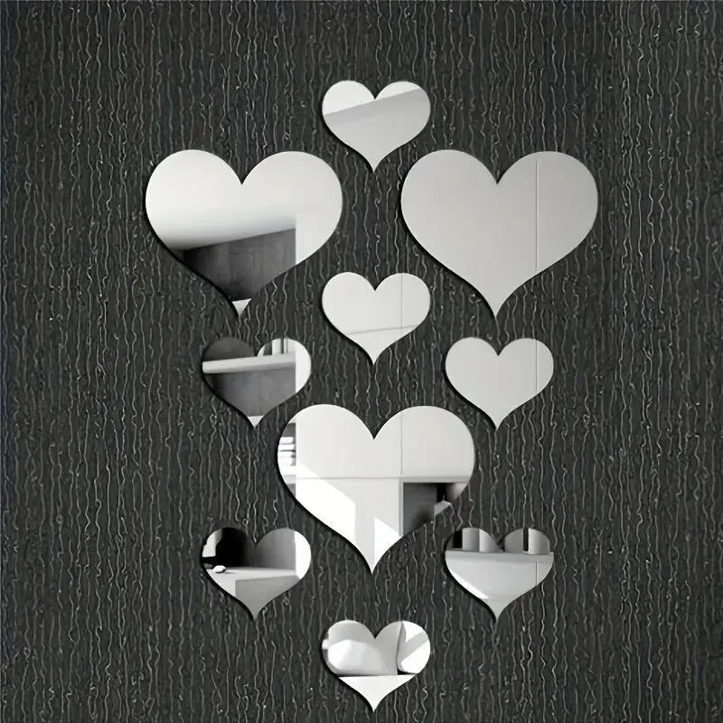 A collection of white 3D love heart mirror wall stickers arranged in various sizes on a dark textured background.