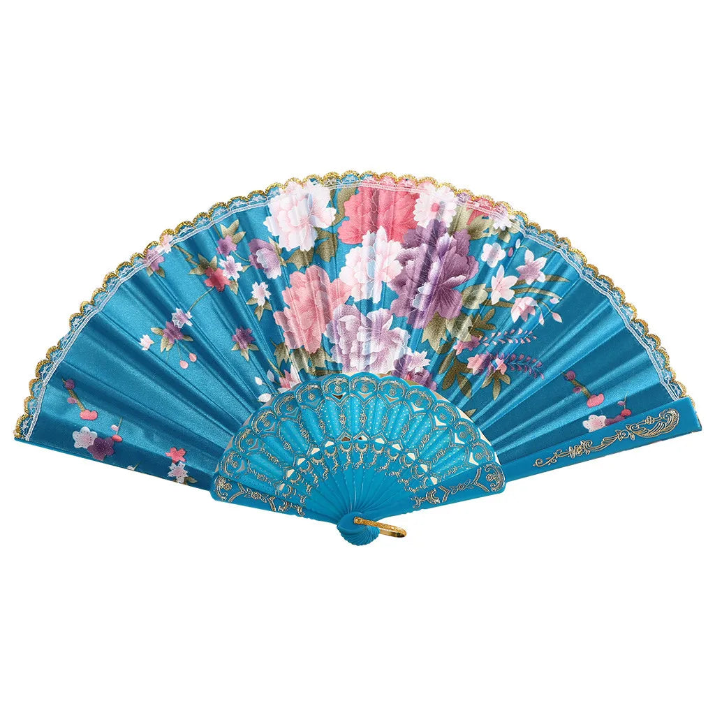 A vintage lace hand fan featuring vibrant pink and purple floral patterns on a teal blue background.