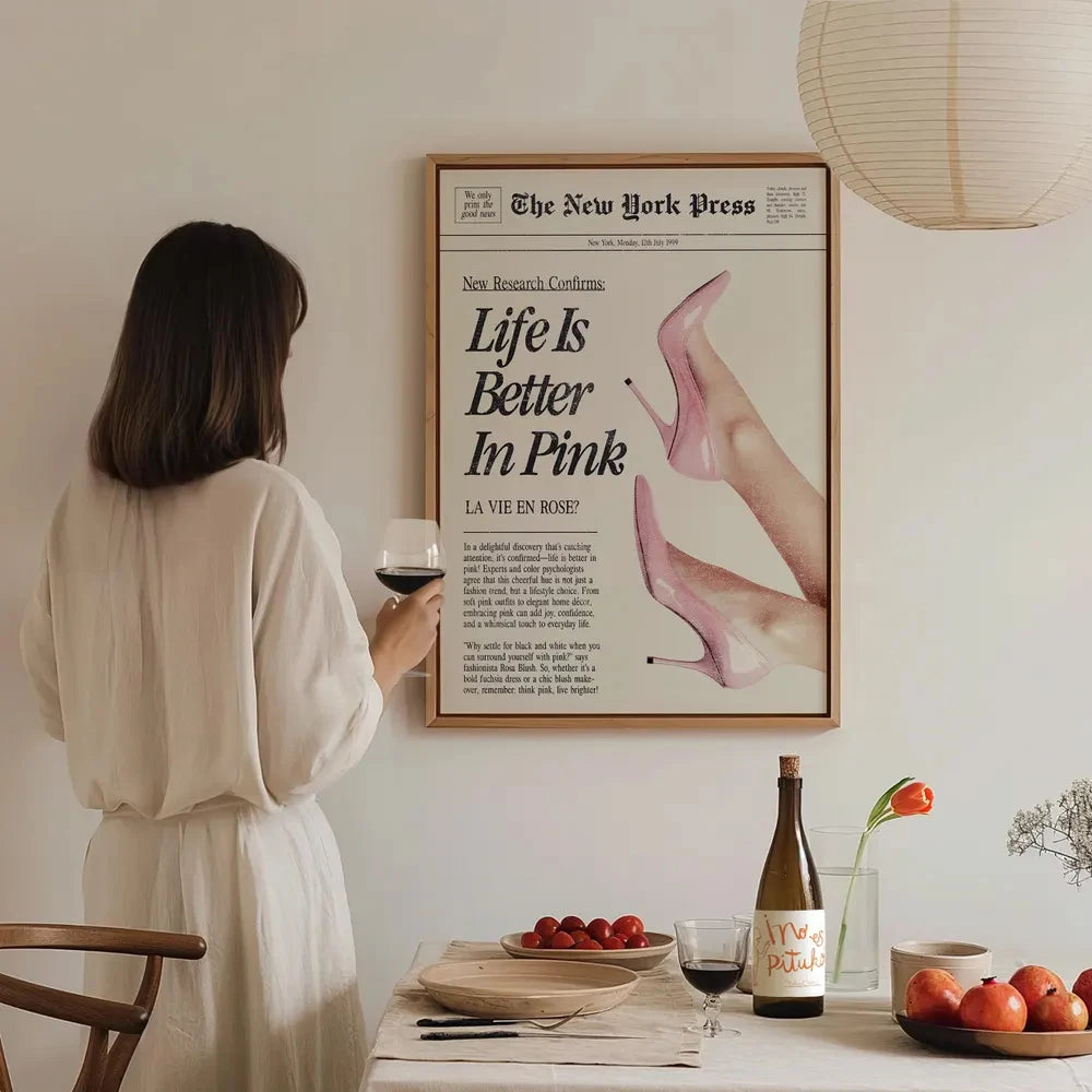 Frameless canvas wall art featuring a pink and black illustration of a hand, titled Life Is Better in Pink