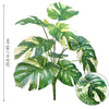 Artificial Monstera plant with silk green and white leaves shown in a vertical arrangement.