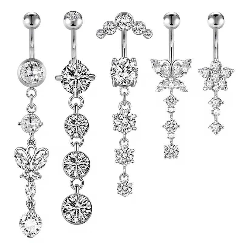 A set of five gold tone butterfly and flower belly rings displayed against a white background.