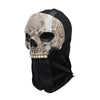 Realistic horror ghost skull latex mask with a white stripe on a black fabric background