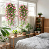 Artificial morning glory hanging vines displayed in a bright room near a window.