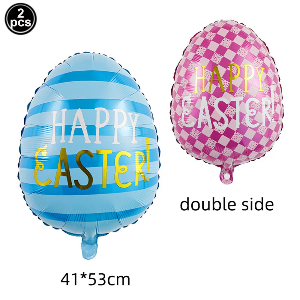 Two foil balloons, one blue with happy easter text and one pink with happy easter text.