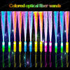 A row of colored optical fiber wands with LED lights displayed against a dark background.