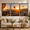 Three minimalist black aluminum picture frames with white mats displaying landscape photography.