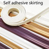 Roll of white self-adhesive flexible skirting strip lying on various colored strips.