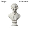 A white plaster bust miniature of a classical figure, used for art practice or home decor.