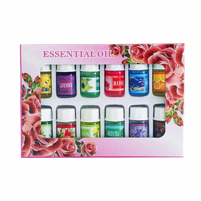 A set of essential oils in glass bottles with labels for Lavender, Rose, and other scents displayed against a pink background