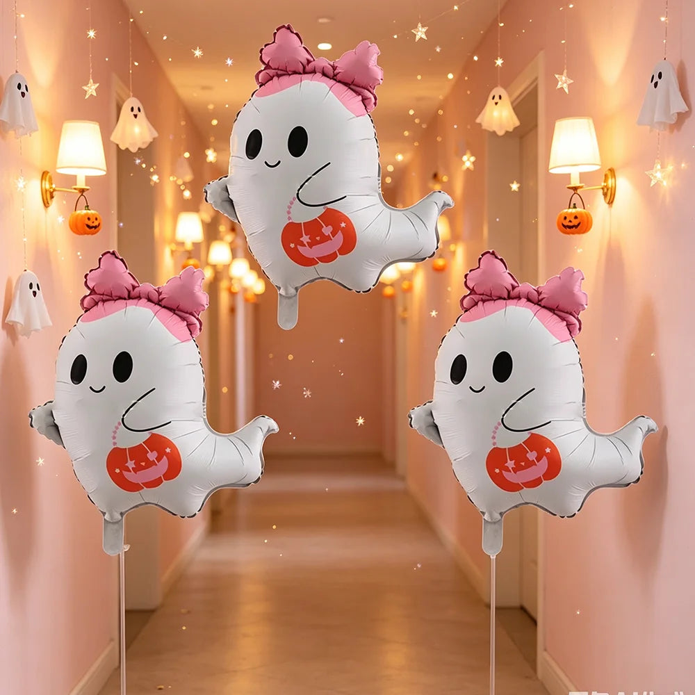 A set of cute white ghost foil balloons with pink bows decorating a hallway for a Halloween party.