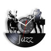 A black silhouette of a jazz musician playing a saxophone and piano on a vinyl record clock face.