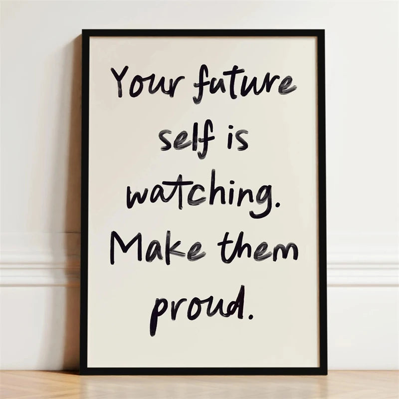 A framed print with black text on a light background that reads Your future self is watching. Make them proud.