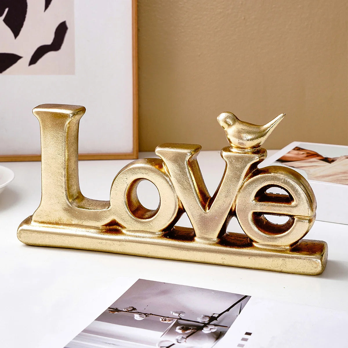 Retro gold and silver foil resin letters spelling the word Love