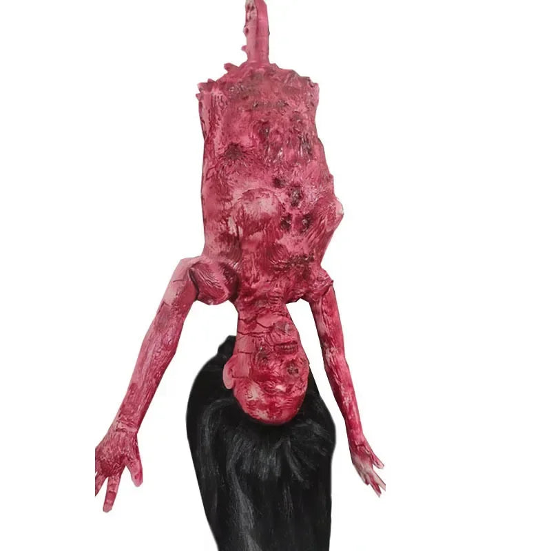 A realistic prop of a hanging corpse used for Halloween decor.