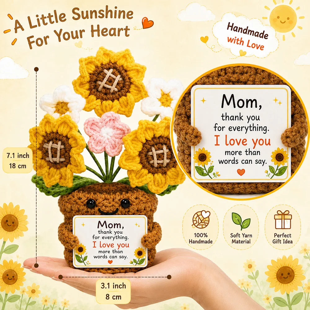 Handmade crochet dog doll in brown yarn with a personalized tag, presented on a hand.
