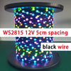 A close-up of a coil of WS2815 addressable LED string lights with black wire, glowing in various colors.