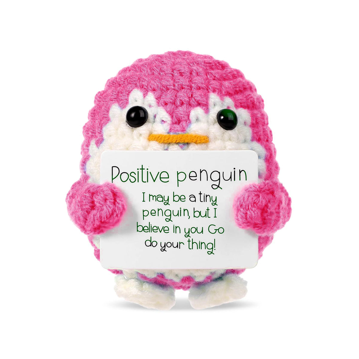 A handcrafted pink and white crochet penguin plush with an encouraging message card.