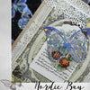 A decorative paper featuring a butterfly design, suitable for journaling or crafts.