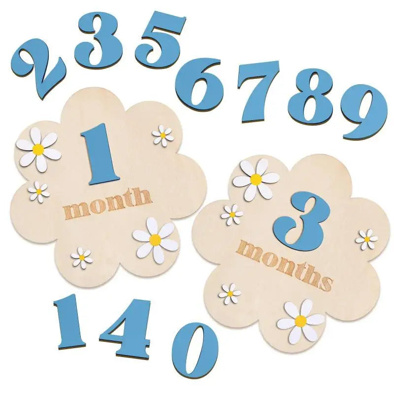 Wooden monthly milestone cards showing numbers 1 through 9 and the word months